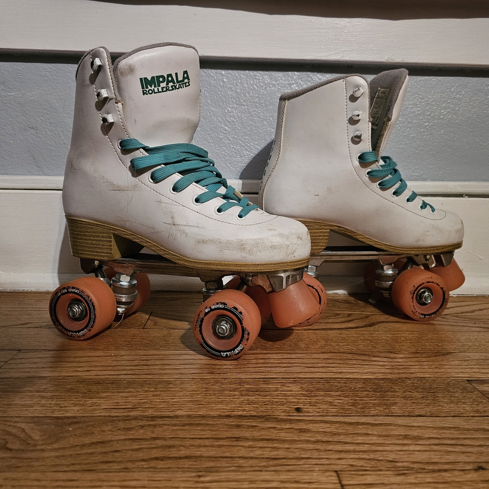 Impala White Roller Skates with Orange Wheels